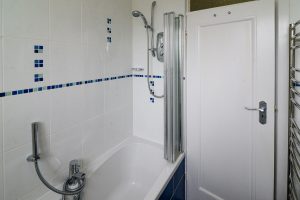 Bathroom at 't Sandt showing bath, overhead shower, hand held shower from tap