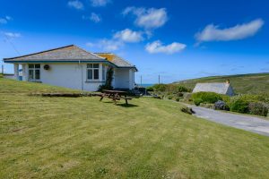 Picture of 't Sandt from the garden to the side of the house with parking area in foreground