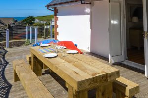 Outside dining benches on the decking at Highview