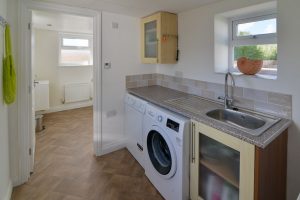 Utility space at Lowena with washing machine and tumble dryer