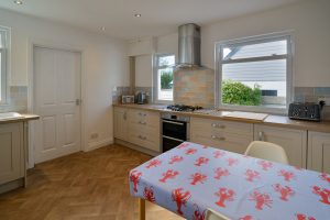 Well equipped kitchen at Lowena with additional dining table