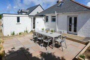 Outside seating and dining area on patio to the rear of Lowena