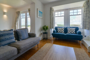 Lounge at Lowena with stairs leading to first floor