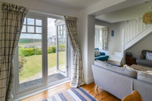 Double doors in the dining area at Lowena leading to the front garden