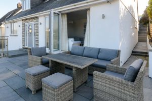Outdoor seating in front garden patio at Pendarves
