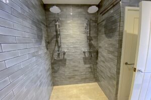 Two overhead, walk in showers in the garage at Pendarves