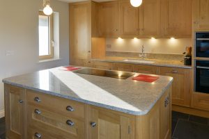 Minimalistic kitchen at Ysella with integrated hob and oven