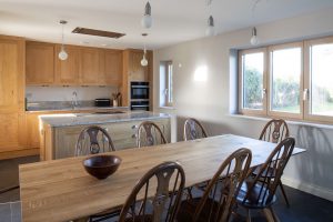 Open plan dining area with views to the rear garden at Ysella