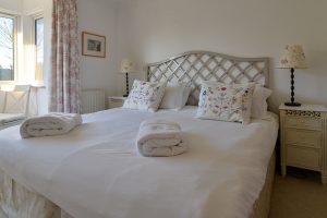 Superking bed in master made up at Bass Cottage