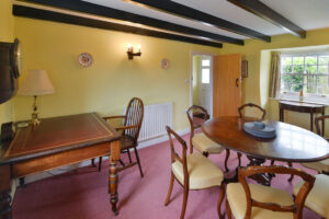 Dining room with beamed ceiling at Treburrick Farm House