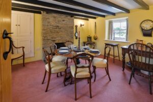 Dining room with beamed ceiling at Treburrick Farm House
