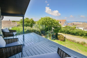 Decked balcony with glass balustrades on the first floor at San Marcos