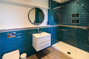 Bathroom off of the utility room with walk in shower at San Marcos