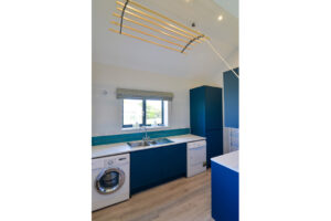 Utility room at San Marcos with tumble dryer, washing machine and clothes airer