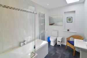 Main bathroom on the ground floor at San Marcos with bath tub and overhead shower