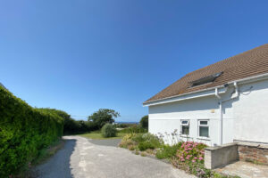 The side exterior of Tristan showing the shared driveway