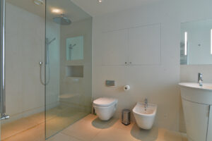 The ensuite to the master bedroom at Spin showing the large shower cubicl, wash basin, toilet and bidet