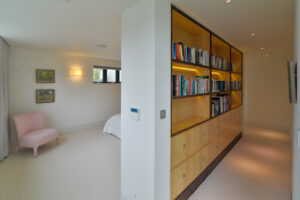 The dressing area for the master bedroom at Spin showing bookcase with books