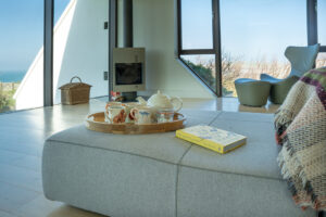Seating in the lounge area at Spin with woodburner in the corner and dual aspect views