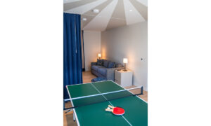 The table tennis in the games area of the sofa room at Spin. The two areas are divided by a large curtain and is also used to access the twin bedroom