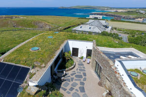 Aerial view over the courtyard at Spin towards Treyarnon Bay, Constantine Bay and Trevose Head