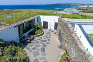 Aerial view over the courtyard at Spin towards Treyarnon Bay, Constantine Bay and Trevose Head