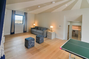 The sofa bed and games area at Spin leading into the twin bedroom which is accessed through the games room.