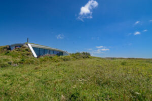 Exterior of Spin from the adjacent field showing the large room length windows which give views from the kitchen, dining and lounge areas