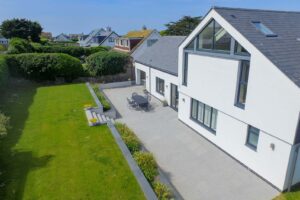 Ariel exterior view of the back of Cornerstones with patio and grassed garden