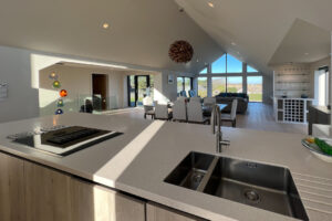 Open plan kitchen, dining area and lounge at Cornerstones