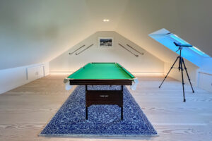 Pool table and telescope in snug room at Cornerstones