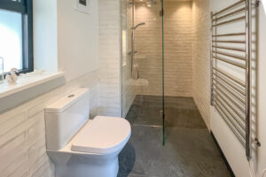 Ground floor double bedroom ensuite with walk in shower at Cornerstones
