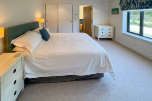 Ground floor ensuite king bedroom at Cornerstones