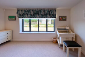 Garden views and vanity area in master bedroom at Cornerstones