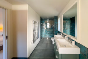 Ensuite ground floor bathroom with walk in shower and Jack and Jill sinks at Cornerstones