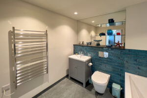 Main ground floor bathroom at Cornerstones with heated towel rail