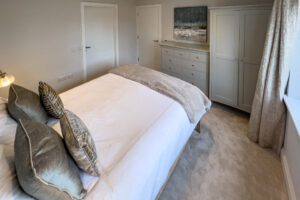 King sized bedroom on the ground floor at No 1 Treglos Gardens with en suite bathroom