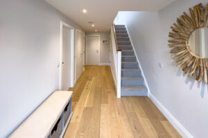 Entrance hall at No 1 Treglos Gardens with staircase leading to the first floor