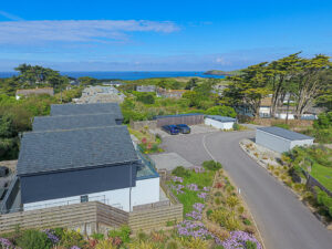Ariel view of No 1 Treglos Gardens with views towards the coast