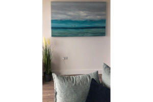 Picture of the sea hanging in the lounge area at Quiescence