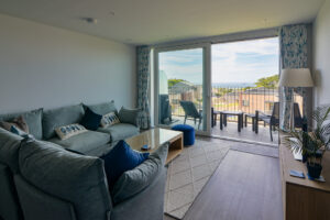 Lounge area with sliding door onto balcony