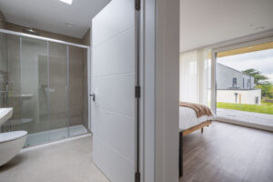 The ensuite to the master superking bedroom at The Look Out with large shower cubicle toilet and wash basin