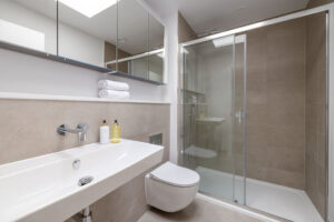 The ensuite to the master bedroom at The Look Out with large shower cubicle, toilet and wash basin