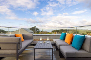 Outdoor sofa type seating and view from the first floor balcony at The Look Out