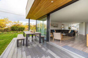 Looking into the lounge area from the patio through large sliding glass doors