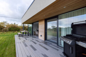 Patio at The Look Out with large glass doors leading into the master bedroom and lounge area at The Look Out