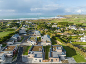 Aerial view of The Look Out also showing view over part of the village and towards the Trevose Head and the ocean