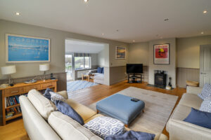 Lounge with log burner and TV at Coronado