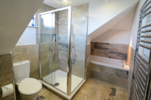 Ensuite bathroom on second floor at Coronado with walk in shower and separate bath