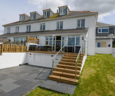 Rear exterior view of Coronado with steps from decking leading to lower garden area